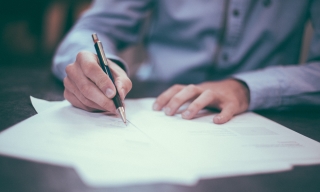 Man writing on paper